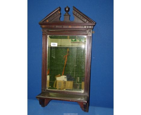 A 19th century Mahogany wall mirror and shelf, reeded frame and broken arch pediment, 25" x 12".