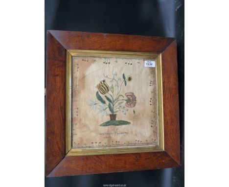 A thick Oak framed and glazed sampler by Julia Langley, March 1806, aged 12: finely sewn silk border and centre panel of a bo