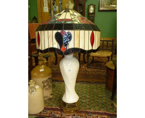 A Tiffany style Lamp with rose design shade, china column and brass base, 36" high.**TOO LARGE / DELICATE FOR PACKING AND DEL