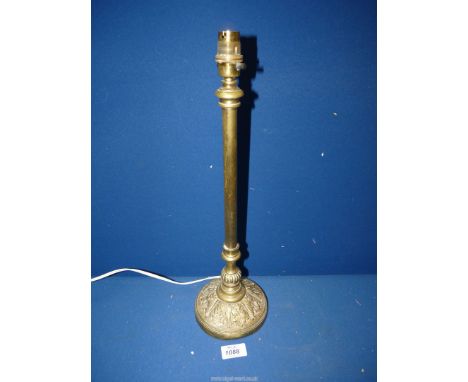 A heavy Brass lamp with acanthus leaf decoration to base, 17 1/4'' tall.