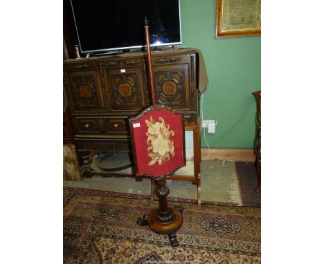 An early 19th century Rosewood adjustable pole screen with perhaps original tapestry banner on turned and nulled column circu
