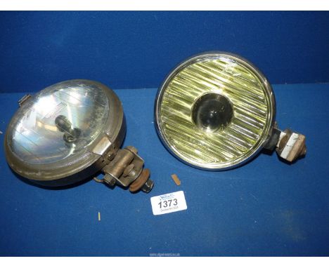 A Wipac 1960's/70's car spot lamp, 5 1/2'' diameter and a Notek 'Foglite' (5 3/8'' diameter) with unusual beam height adjusti
