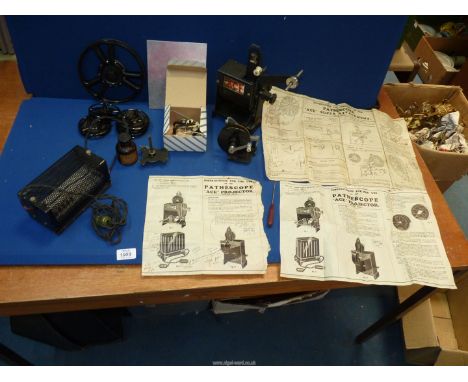 A Pathescope 'ACE' Projector with instructions.