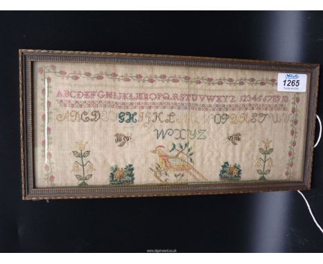 A small early 19th c. silk sampler showing bees, trees, houses, birds and strawberry border, 13 1/2'' x 6 1/4''.