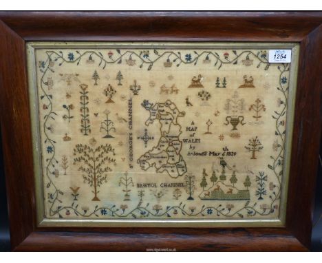 A Rosewood framed sampler by A. Jones, May 6th, 1839, a very rare silk map sampler of Wales with honeysuckle and strawberry b