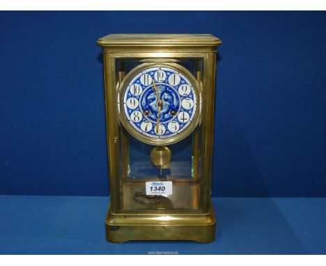 A circa 1870's century French mantle clock by Victor, brass cased, the dial attractively enamelled in blue with a pair of dra