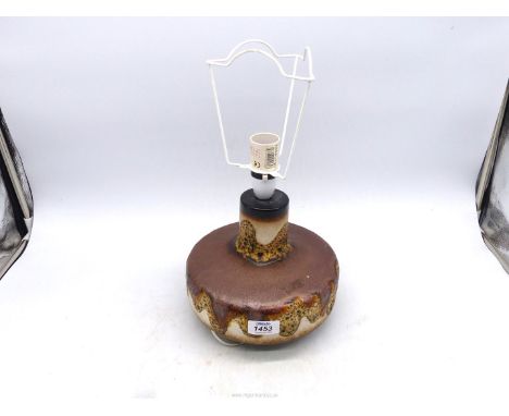 A squat circular German pottery lamp base.