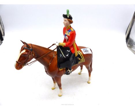 A Beswick model of Queen Elizabeth II mounted on 'Imperial' Trooping the Colour 1957, 10 1/2" tall.