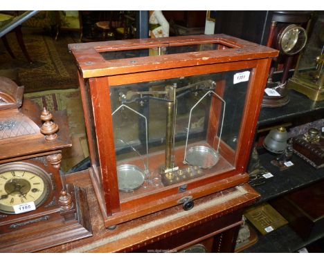 A '"Nivoc" Scientific scales wood and glass case complete with weights.