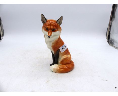 A Royal Worcester figure of a sitting Fox, 7 1/4" tall.