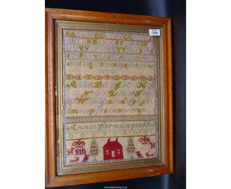 A Maple framed sampler by Anne Gorman, Peebles, 1811 with 'Red House' motifs, alphabet and cross borders, 12'' x 16 1/2''.