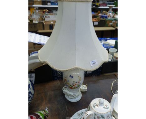 An Aynsley 'Cottage Garden' lamp having white shade.
