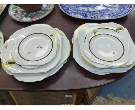 A part set of Shelley Art Deco porcelain breakfast and dinner service decorated in yellow and black geometric design, thirtee