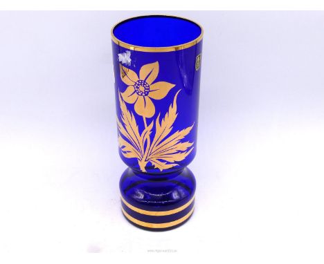 A vintage Czechoslovakian cobalt blue glass vase with flawless gilt foliage decoration and having a couple of very slight scr