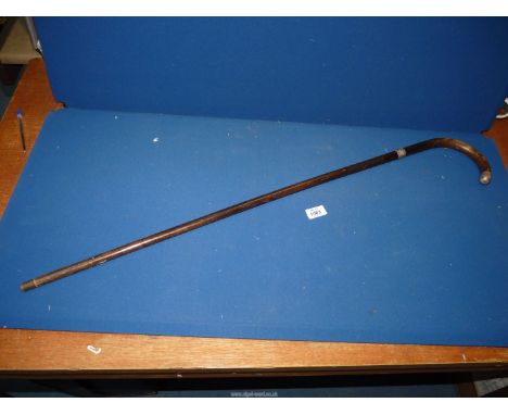 A Walking stick with silver collar and tip, London 1930.