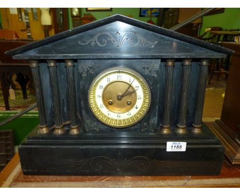 A slate Mantle clock with three pillars to both sides and having Arabic numerals, with key, 16 1/2" x 6" x 12 1/2" high.