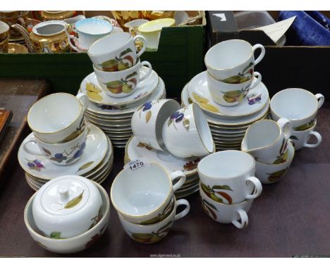 A quantity of Royal Worcester Evesham Gold to include cups and saucers, tea plates etc.