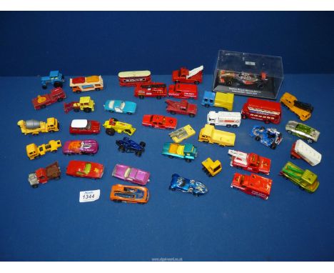 A small quantity of model vehicles to include cased Vodaphone McLaren Mercedes Lewis Hamilton 2009 season, Matchbox, etc.
