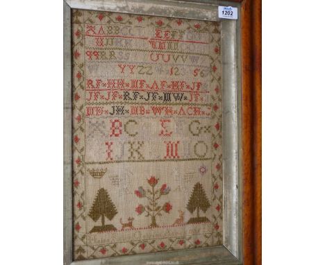 A burr Maple framed and glazed sampler by Helen Kinry, Galstron, aged 11, 1835: with family initials, Tree of life, trees, bi
