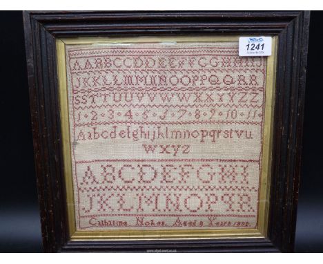A small alphabet school sampler by Catherine Nokes, aged 8, 1832, 9'' square.