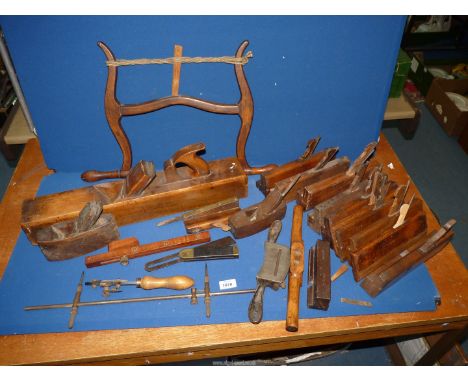A large quantity of late 19th century wooden Carpentry tools to include a 22" solid wood box plane plus two smaller, approx. 