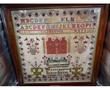A Welsh woolwork Sampler by Rachel Watkins, aged 14, March 12th 1883, with alphabet, symmetrical floral motifs, central large