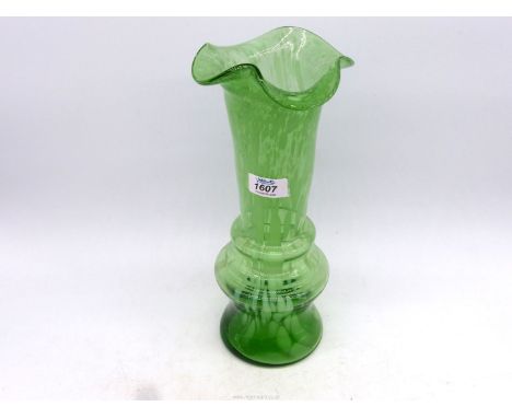 A vintage Spatter glass vase in lime green with random cream steaks and patches and having a deep concave base with rough pon