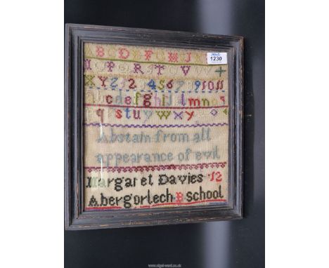 A 19th c Welsh wool sampler by Margaret Davies, aged 12, Abergorlech B. School 10'' x 11''.