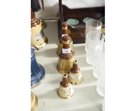 TWO BELLS OLD SCOTCH WHISKEY 6 2/3 fl oz CONTAINERS AND TWO SMALLER (smaller lacking stoppers( (4) 