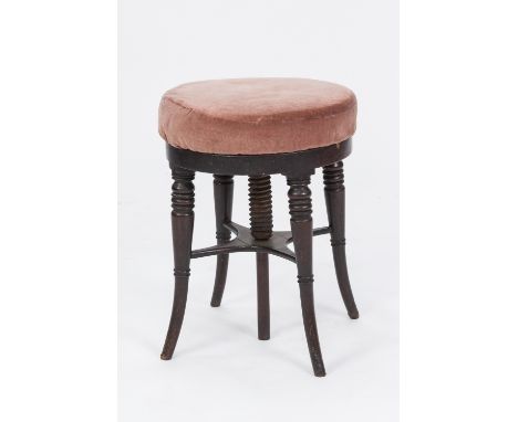A GEORGE IV MAHOGANY HEIGHT ADJUSTABLE MUSIC STOOL on four turned and outset legs 