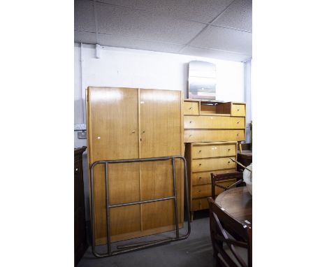 A TEAK AND PLYWOOD 1950's BEDROOM SUITE OF THREE PIECES, VIZ A DOUBLE WARDROBE, DRESSING TABLE AND CHEST OF DRAWERS (3) 