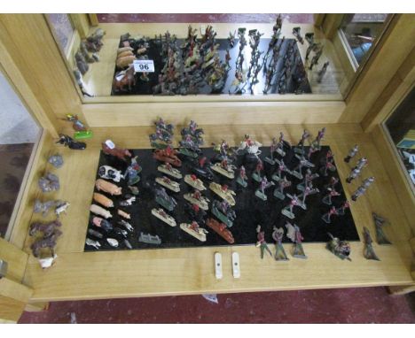 Shelf of lead soldiers and animals to include Britains