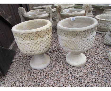2 Mayan Urns, Circular planters decorated with Aztec design on circular bases