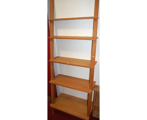 A contemporary light oak open waterfall wall shelf; together with a similar two-tier hanging wall shelf (2)