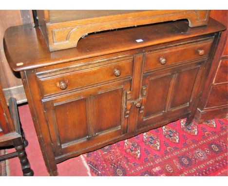 An Ercol dark elm dresser base, width 122cm