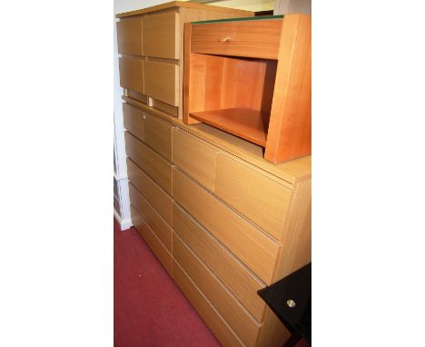 Contemporary light oak bedroom furniture to include a pair of chests each of two short over four long drawers, width 80cm, an