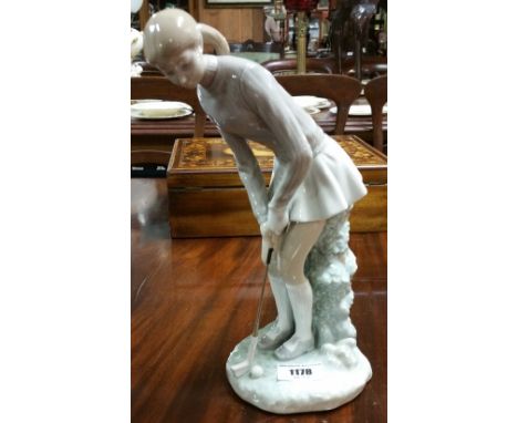 A Lladro Figure of a Lady Golfer, 26.5cm high.