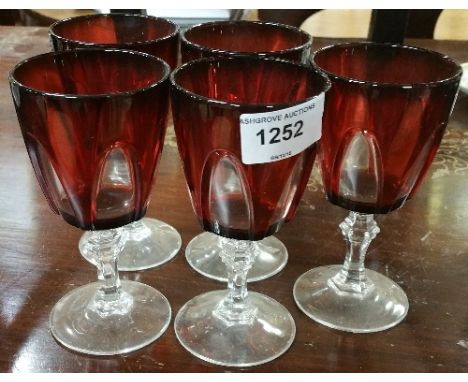 A Set of Five Ruby Wine Glasses.