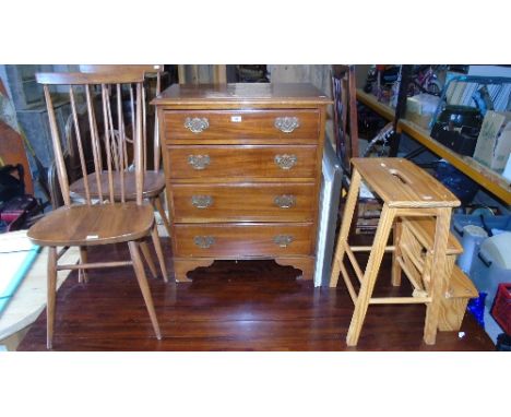 A Mahogany Chest of Four Long Drawers of Neat Proportions with brass handles and back plates, on bracket feet. 27ins wide, 33