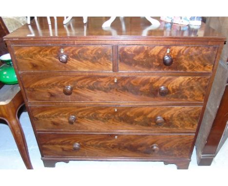 A Very Good Georgian Mahogany Chest of Drawers, having two short over three long drawers and standing on bracket feet.