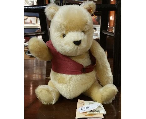 A Steiff Winnie the Pooh Bear.