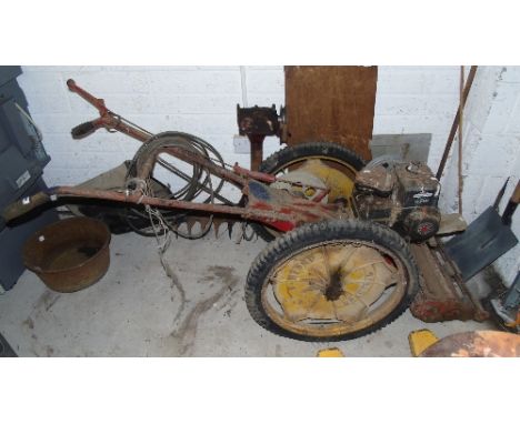 A Vintage Bamford Mower; having an extra finger bar attachment, fitted with a later Briggs and Stratton 3 HP engine.