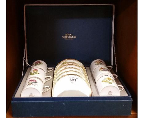 A Set of Six Hand-Painted Royal Worcester Coffee Cups and Saucers in original box.
