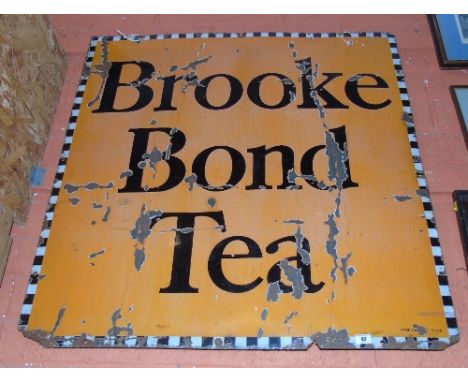 A Brooke Bond Tea Square Enamel Advertising Sign; black lettering on orange background, with black and white chequered border