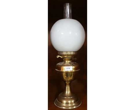 An Early 20th Century Brass Oil Lamp with Cloudy Shade.