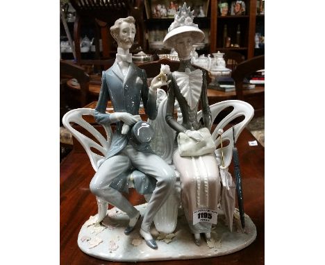 A Large Lladro Figural Group of an Elegant Couple.