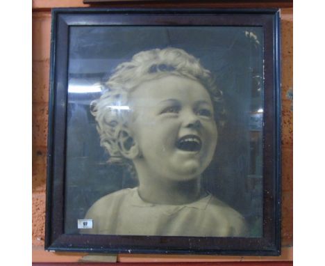 A Large Glazed Black and White Print of a Young Girl. 46 x 49cm.