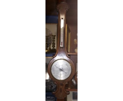 A 19th Century Rosewood Wheel Barometer with an engraved silvered dial and scale.