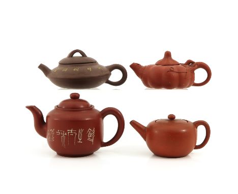 In a variety of  decors and sizes, tallest teapot is 10 cm., chip.