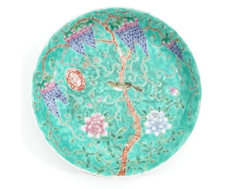 Light green ground with Famille Rose enamels depicting grapes and flowers with birds, Yongqing Changchun mark, 24 cm. in diam
